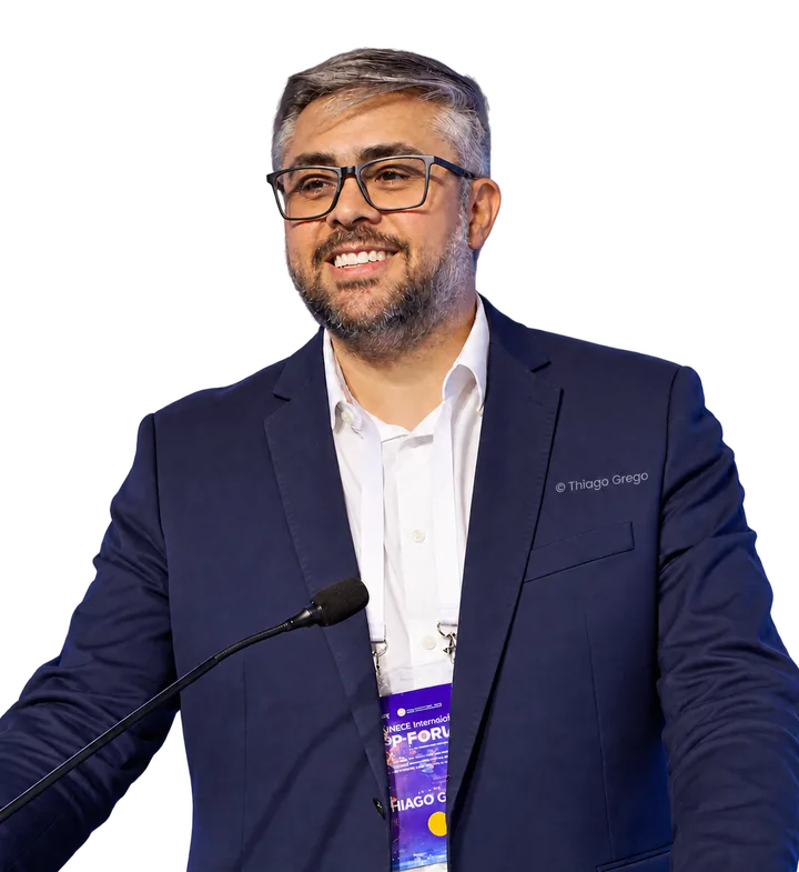 Thiago Grego at a microphone, in a portrait published by ICLEI